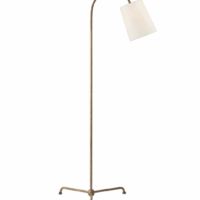 The Mia Floor Lamp features a gilded iron tripod base with a cylindrical linen shade.